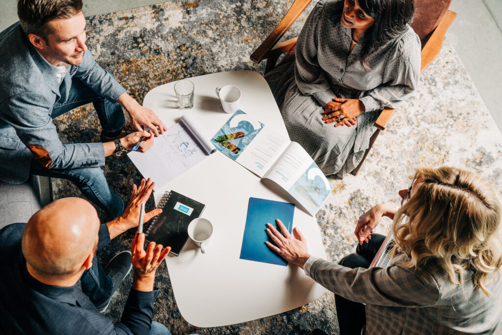 3fold employees holding a meeting in their office space